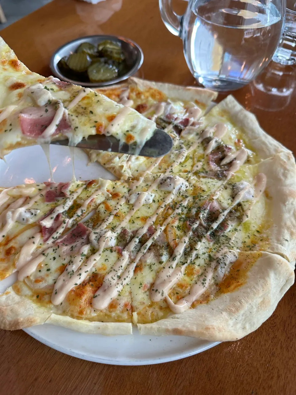 A pizza slice showing the crispy crust