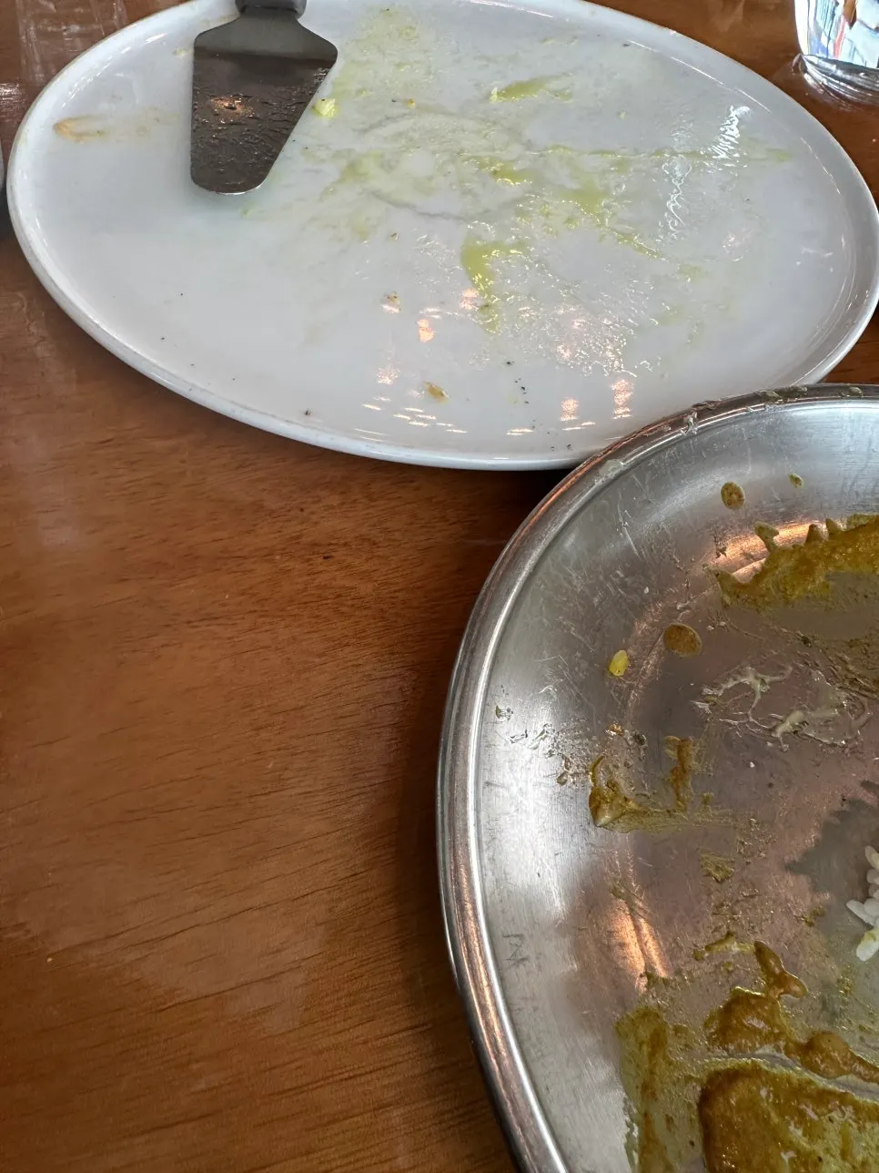 An empty pizza plate, finished without leftovers