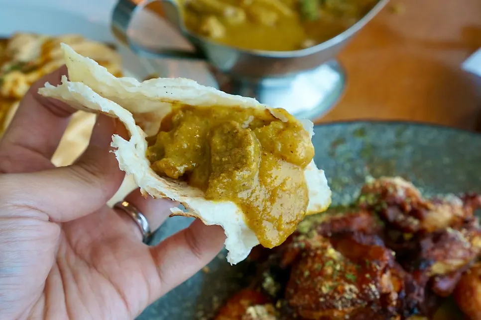 Curry bowl and naan set together on the table