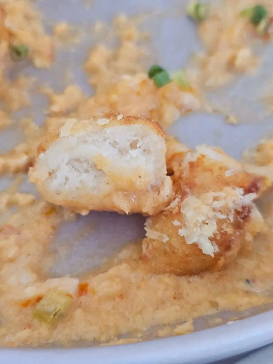 Close-up of gnocchi coated in gochujang cream sauce