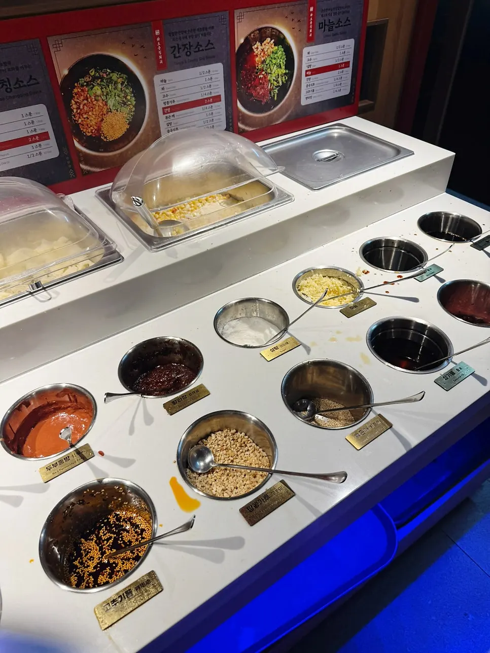 Various sauce ingredients laid out at the sauce bar