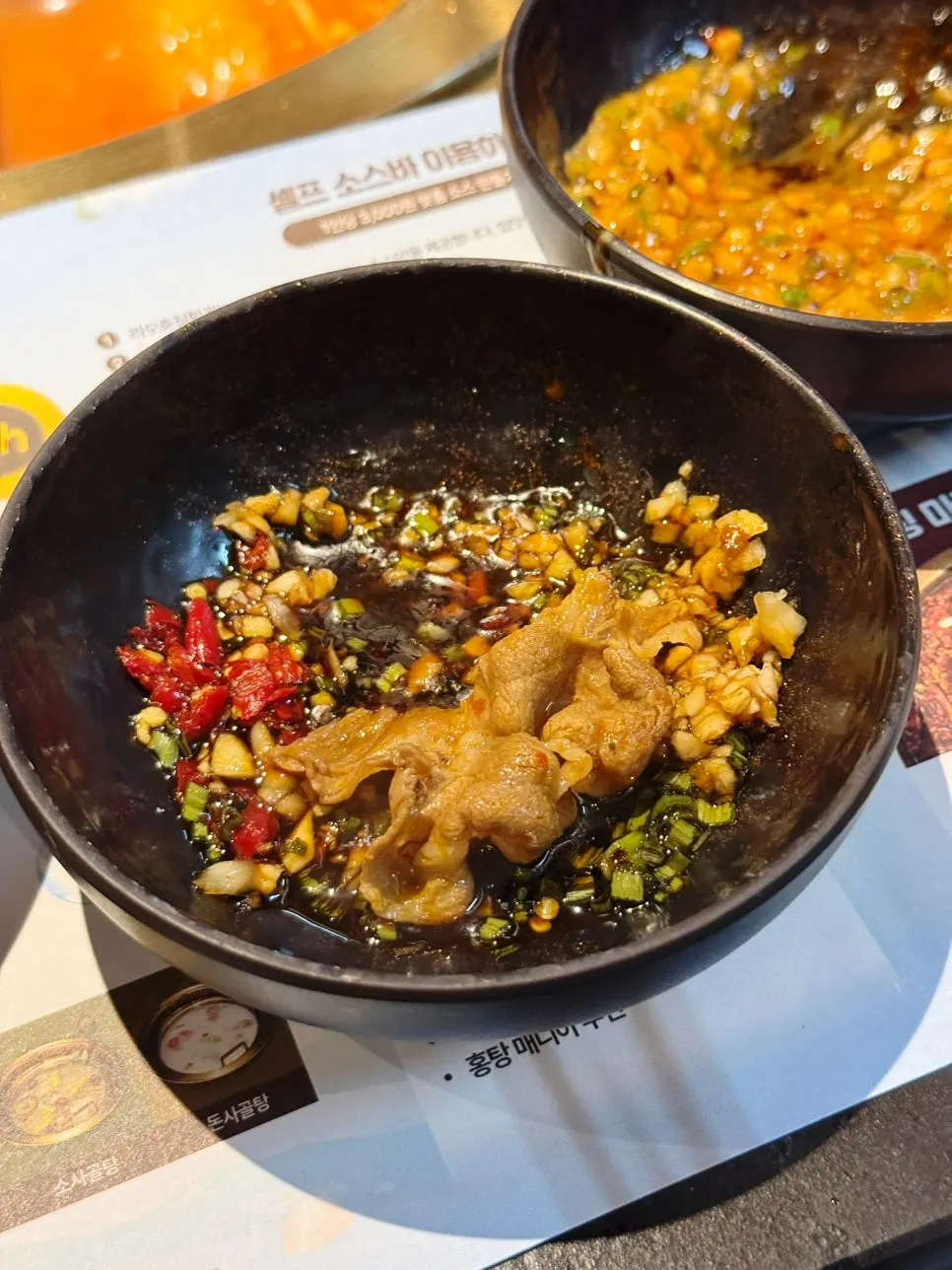 Adding meat into the boiling hotpot