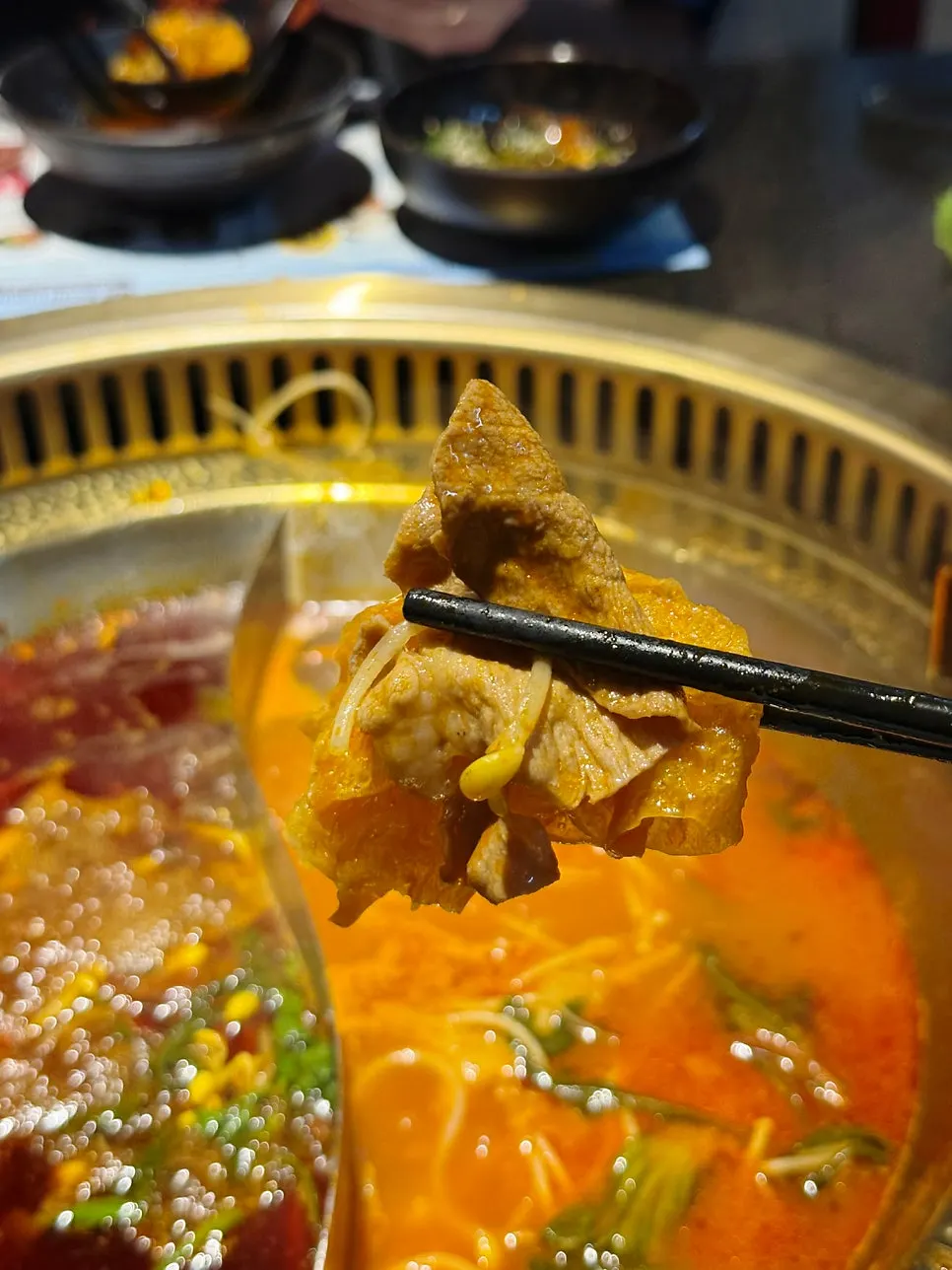 Close-up of hotpot ingredients dipped in sauce