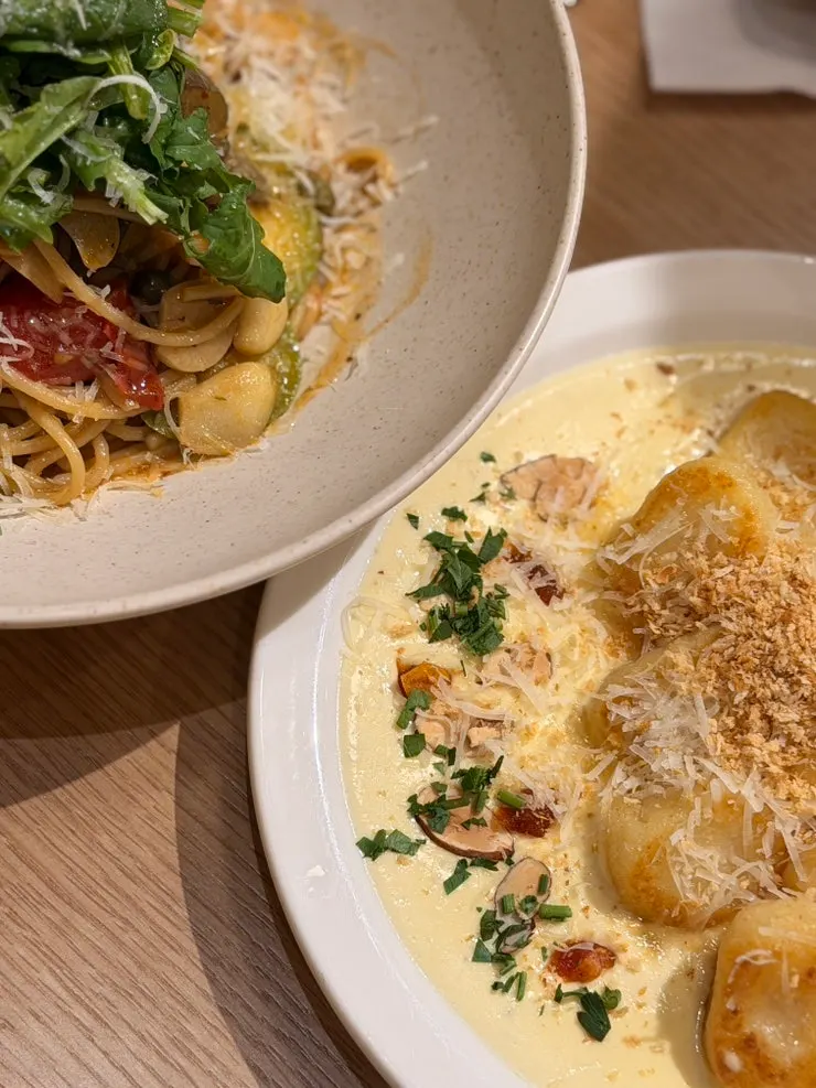 Noodles lifted up from the rucola anchovy pasta
