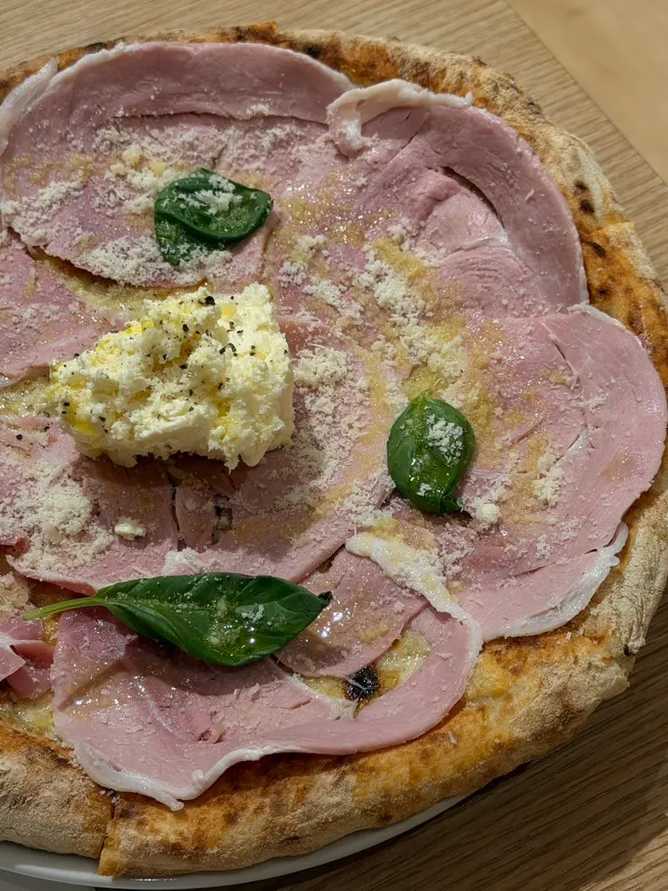 Cotto e ricotta pizza fresh from the wood-fired oven