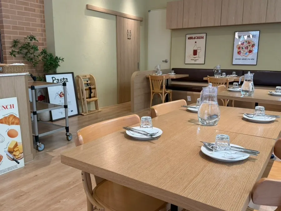 Table setting in the wood-toned interior of Raon Sik Tak
