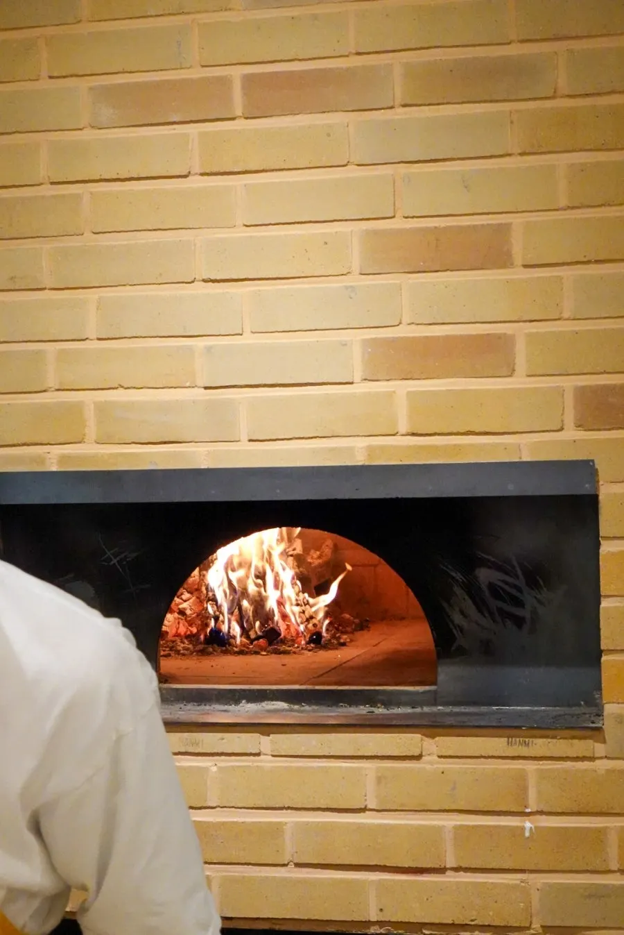 Fire blazing in Raon Sik Tak's pizza oven
