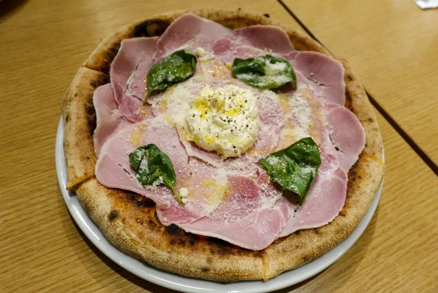 A whole wood-fired cotto e ricotta pizza