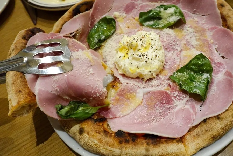 Close-up of cotto ham piled like flower petals