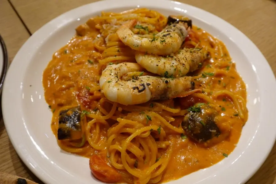 Shrimp rosé pasta topped with big shrimp