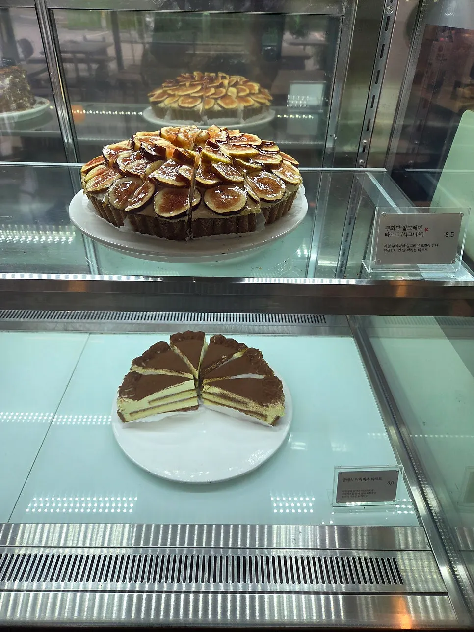 Basque cheesecake and financiers on display at Lapins