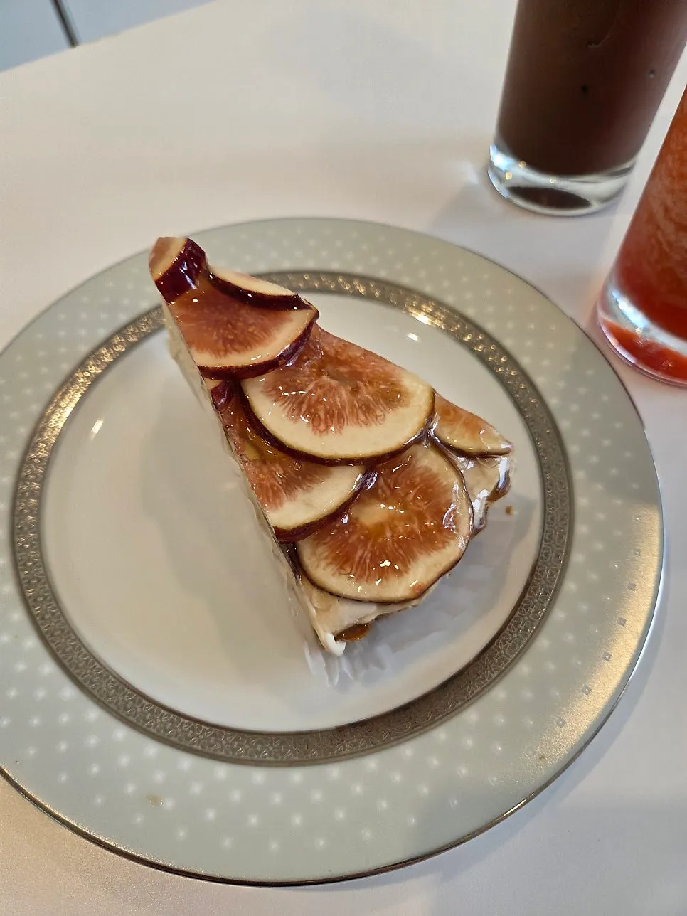 Side view of fig tart brushed with glossy syrup