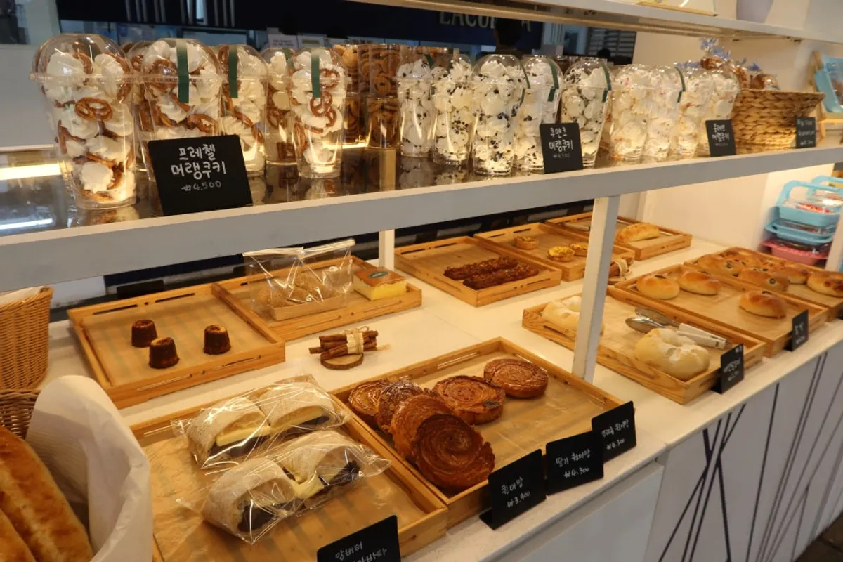Table with La Cuesta bakery items and a signature drink