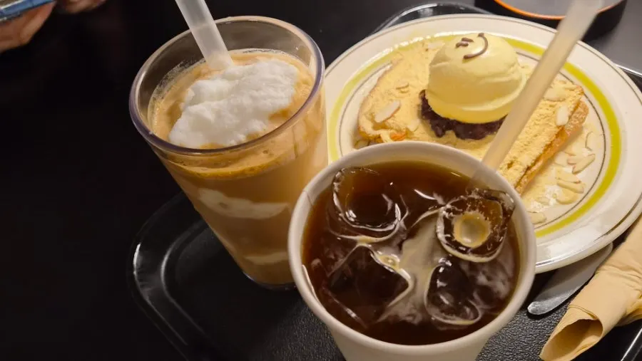 Table spread of iced Americano, coconut latte, and Hongrad toast
