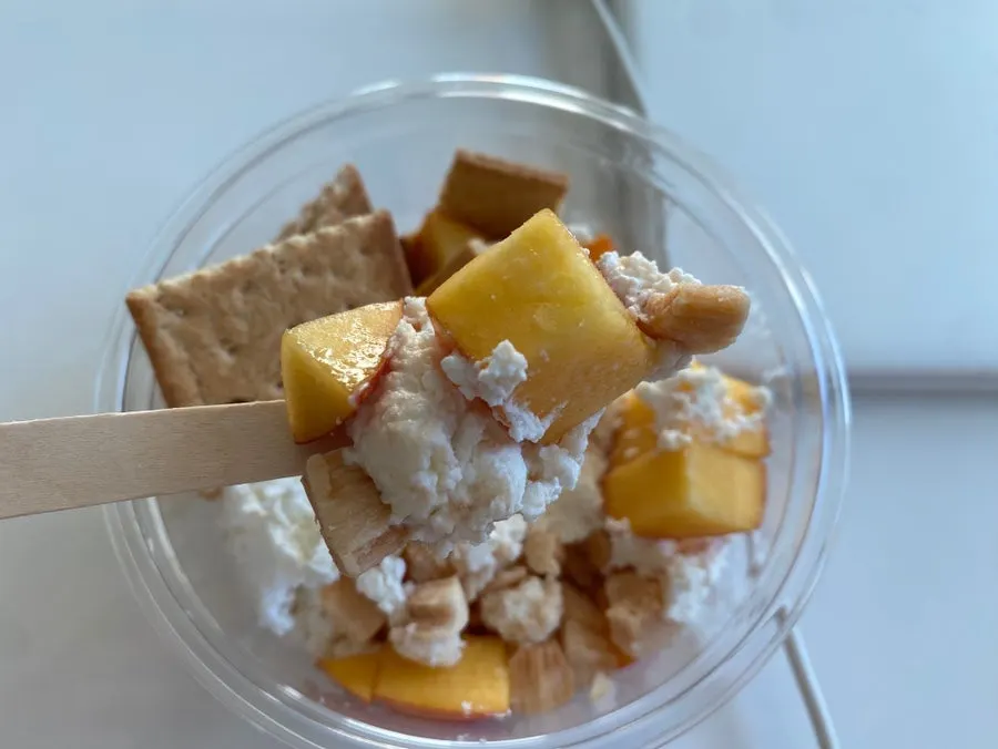A bite of clean-tasting Greek yogurt with peach