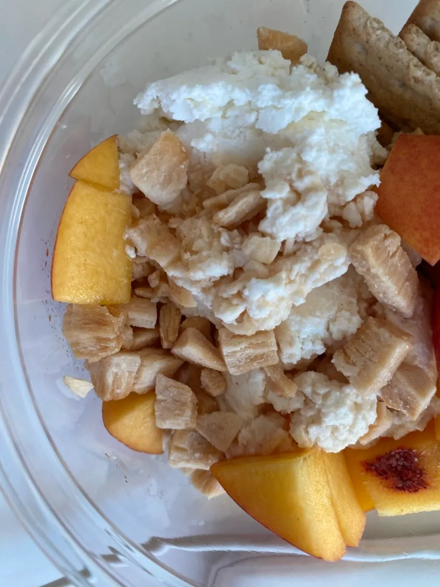Greek yogurt with coconut chunks on a cracker