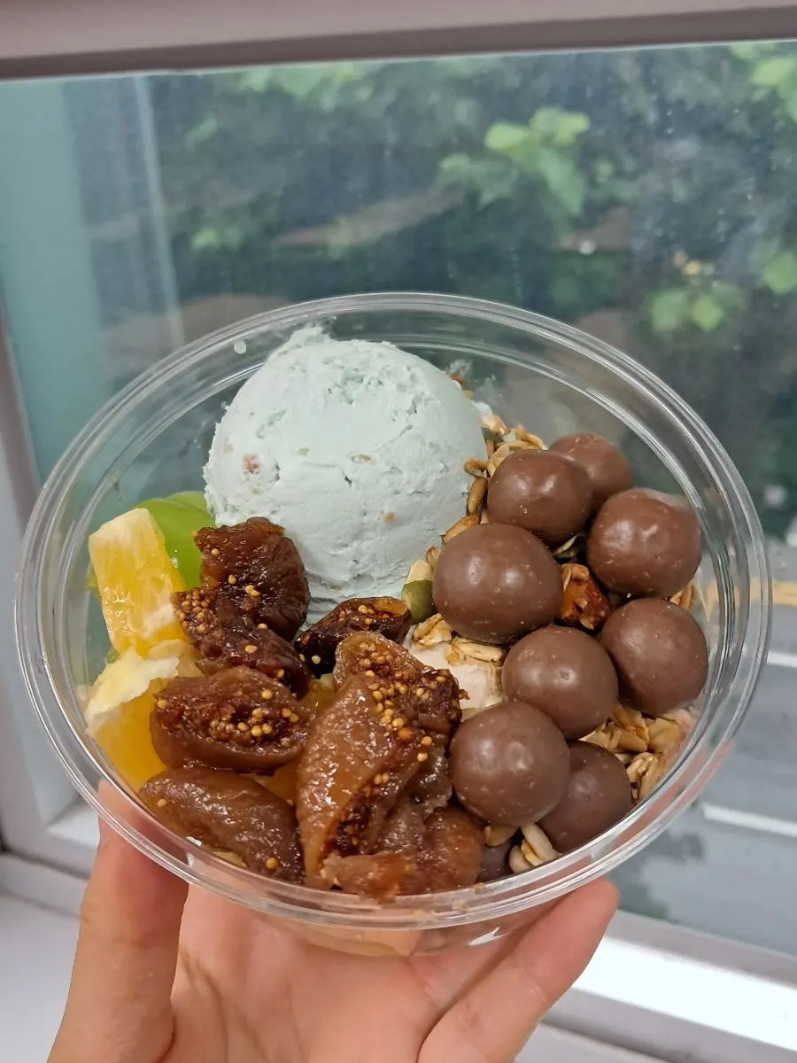 Claire Greek yogurt topped with orange and green grape