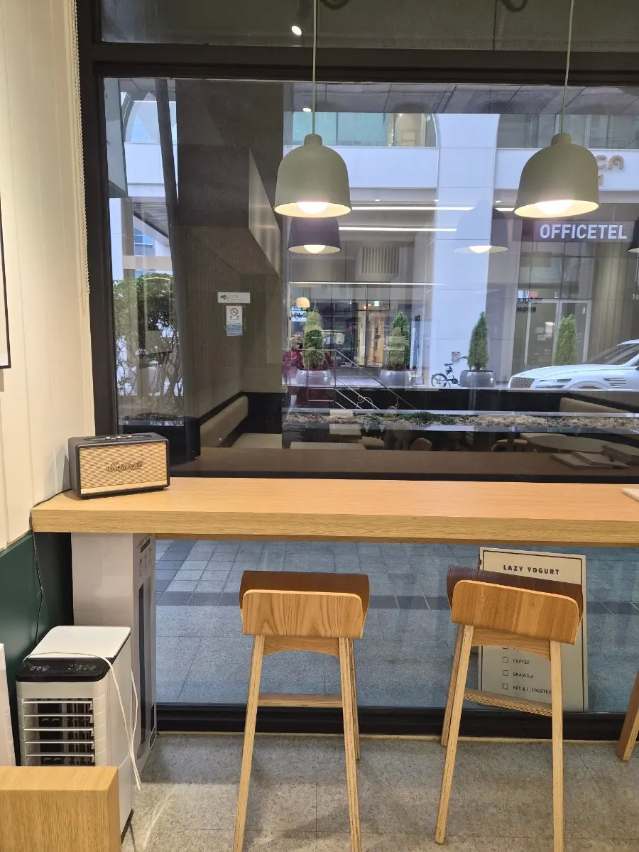 Window bar seating with white and wood interior