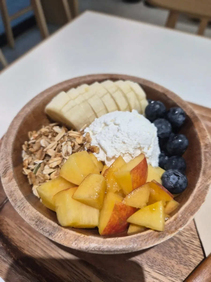 Thick plain Greek yogurt topped with peach