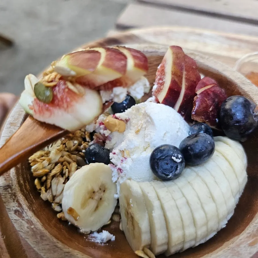 A spoonful of Greek yogurt lifted up