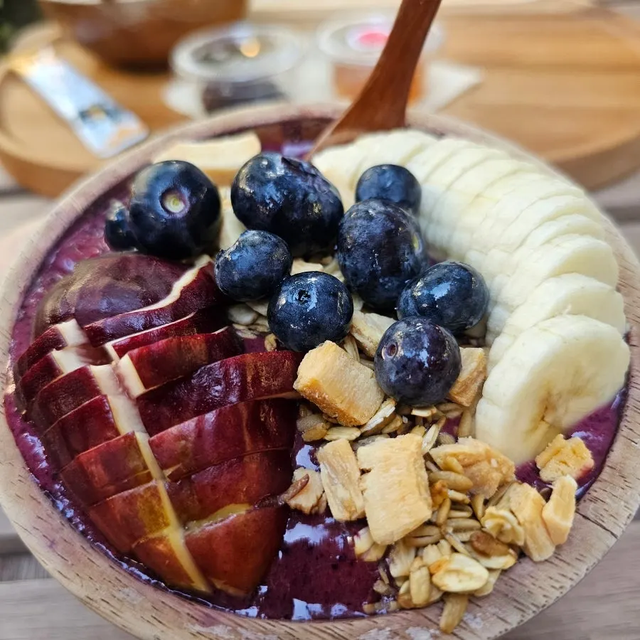 A big spoonful of the acai bowl lifted up
