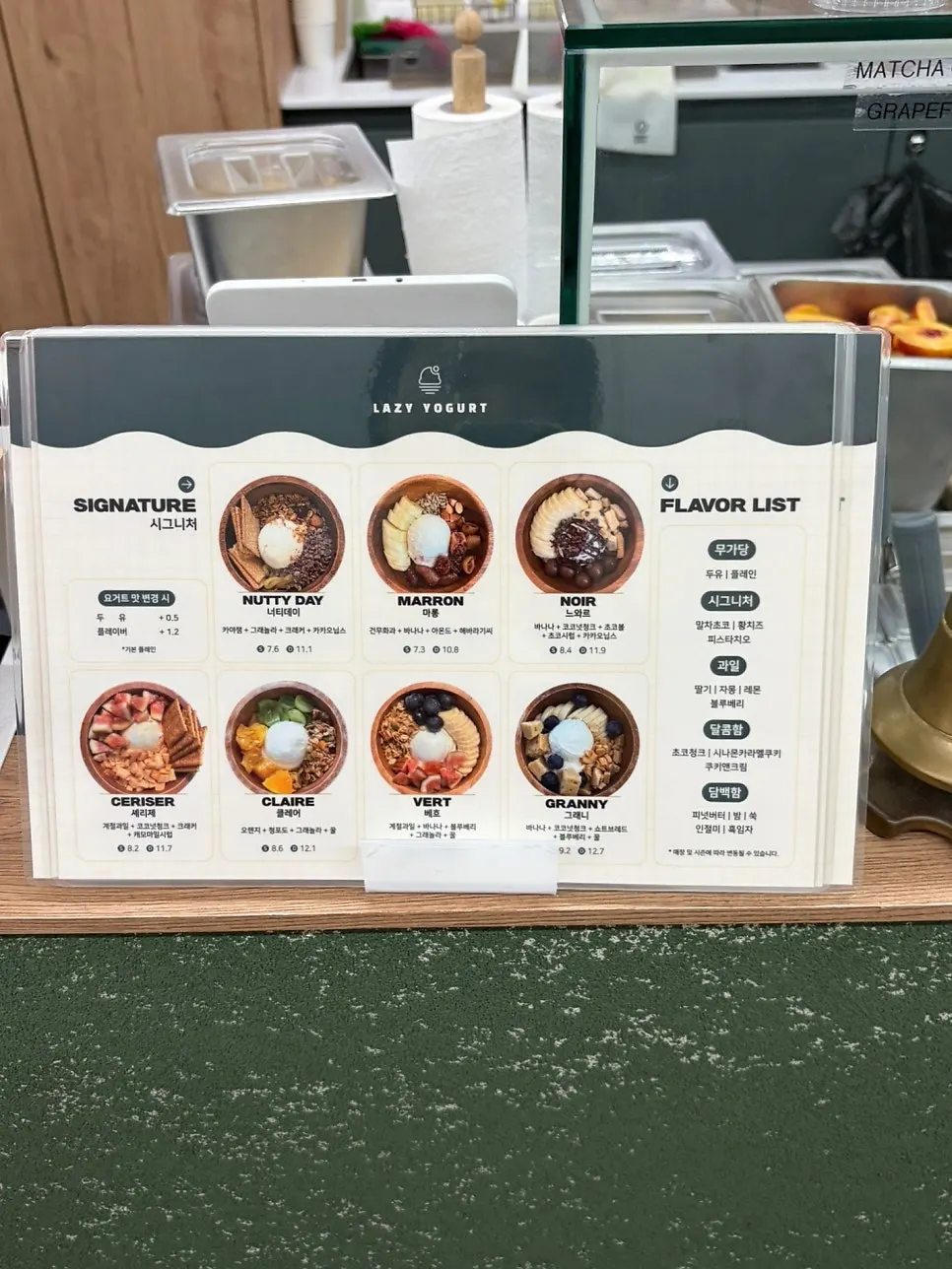 Menu and signature combos displayed at the Lazy Yogurt counter