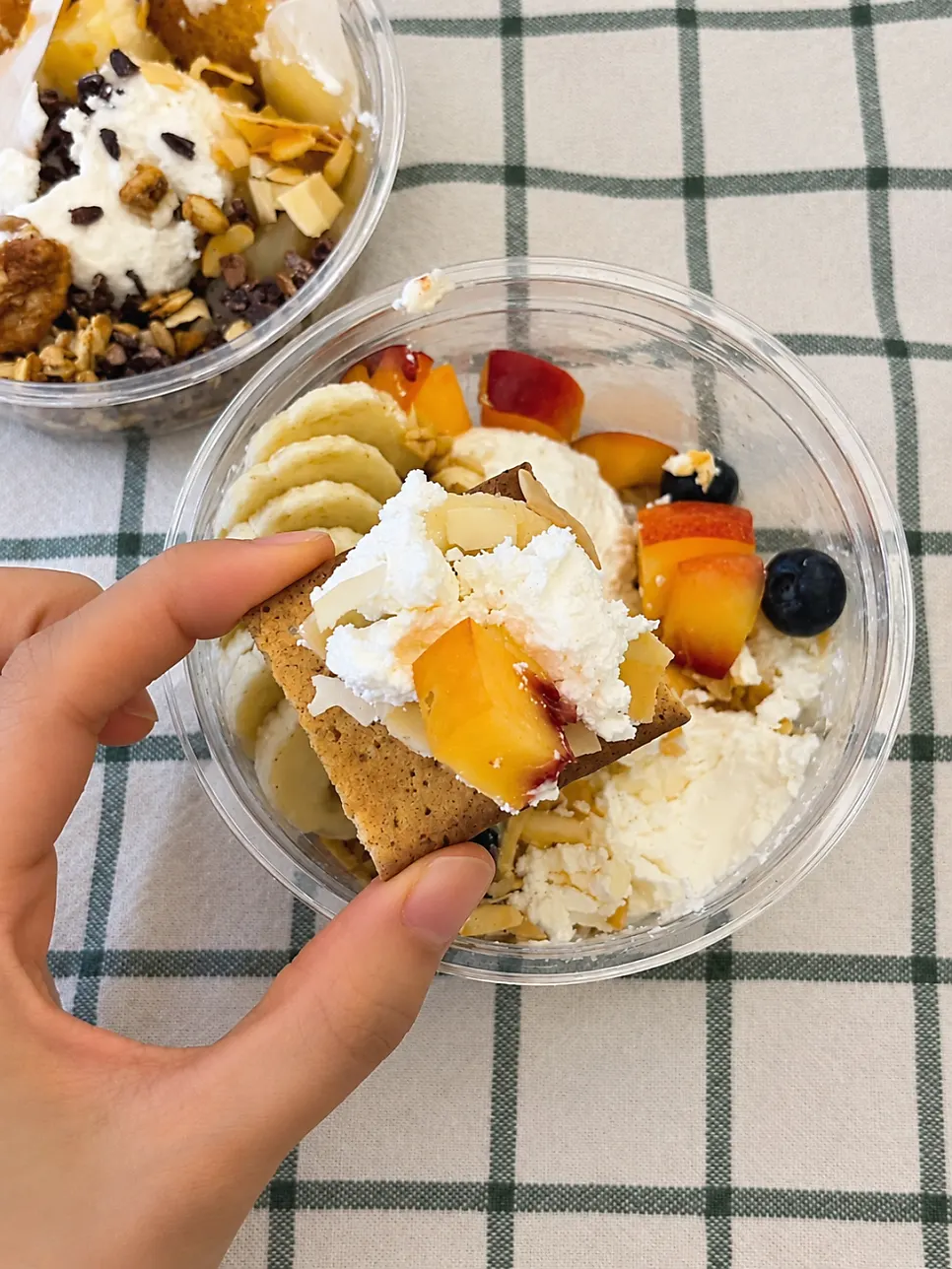 Cracker topped with Greek yogurt and plum as finger food