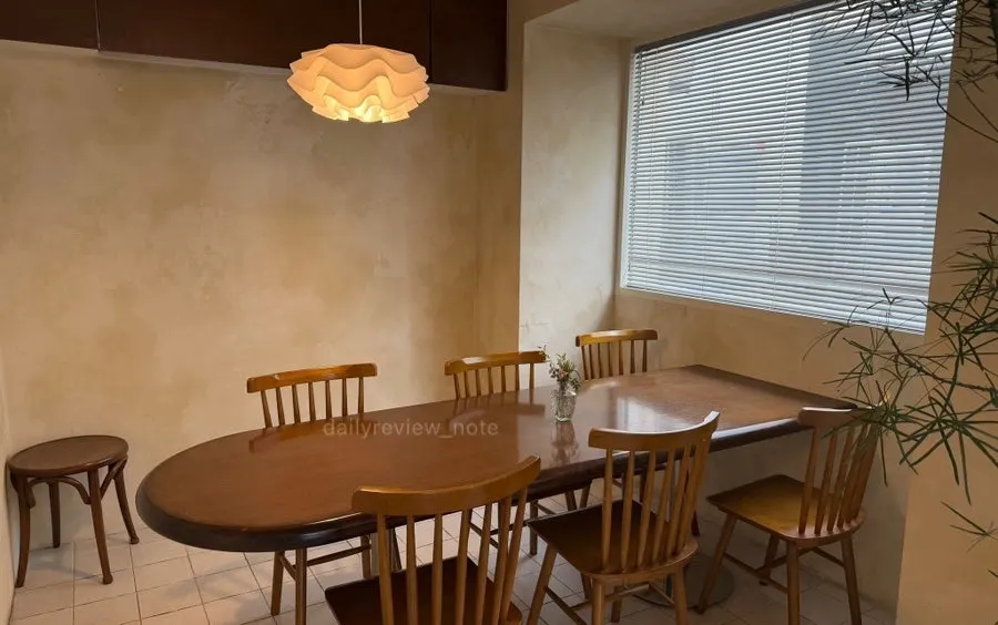 Interior with bar table and single seats at Le Bon Goûter