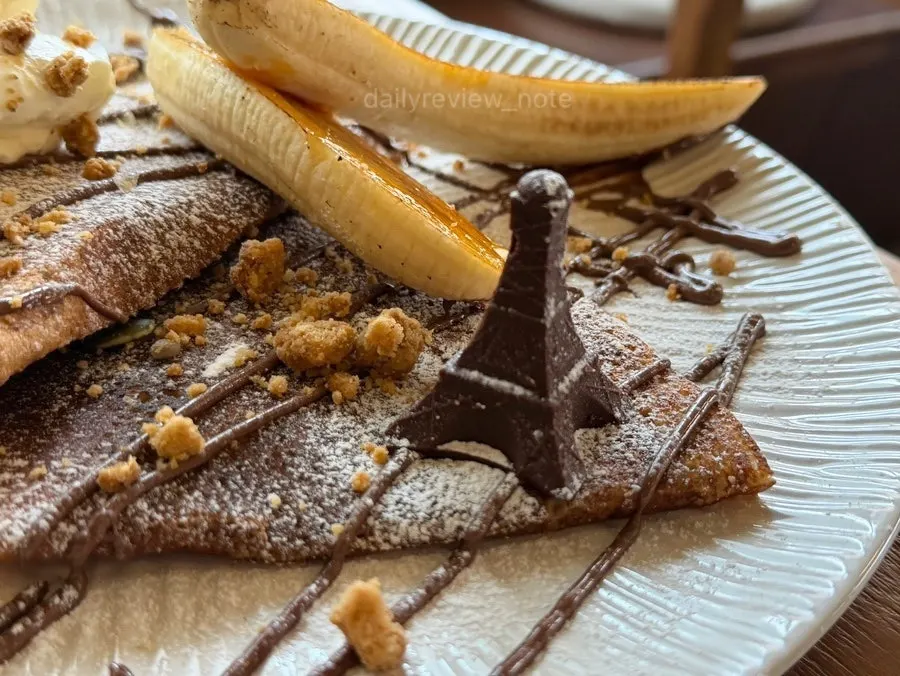 Banana brûlée galette topped with an Eiffel Tower-shaped chocolate
