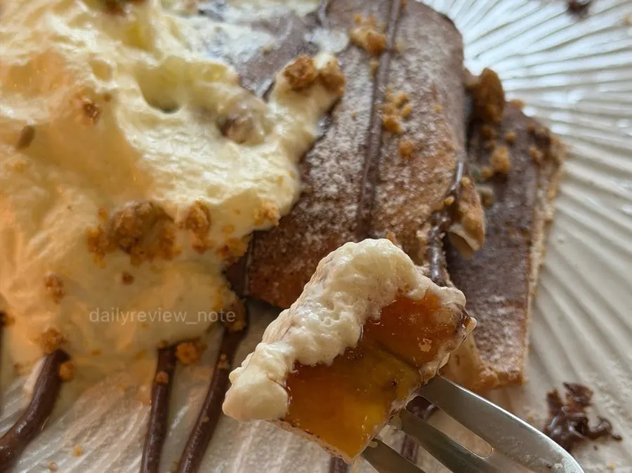 A piece cut from the banana brûlée galette