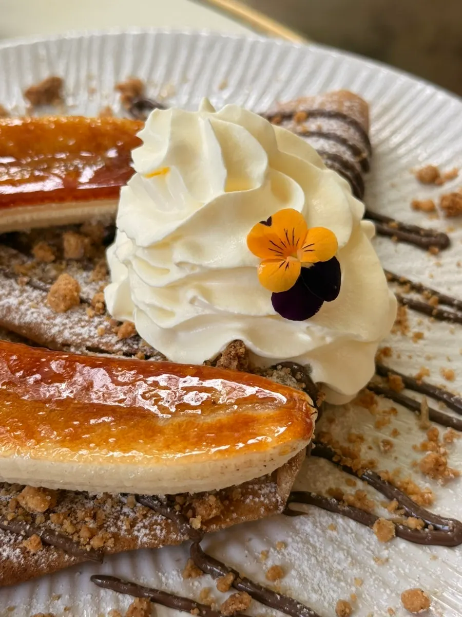 Banana brûlée galette served with whipped cream