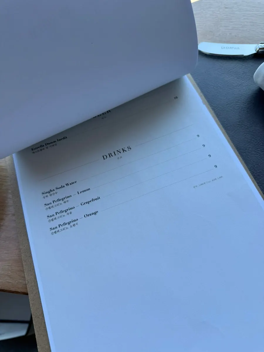 Le Cochon menu page listing optional add-ons