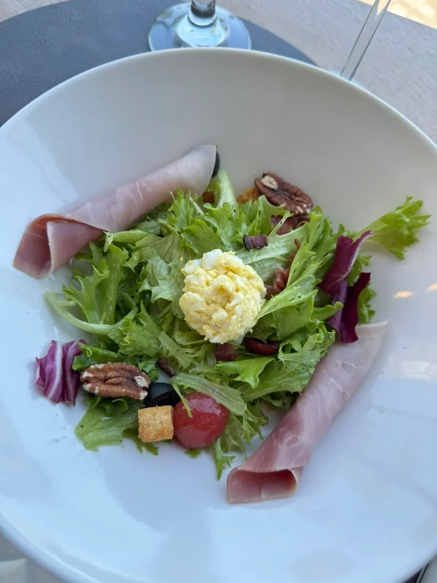 Lyonnaise salad with egg cream and jambon ham