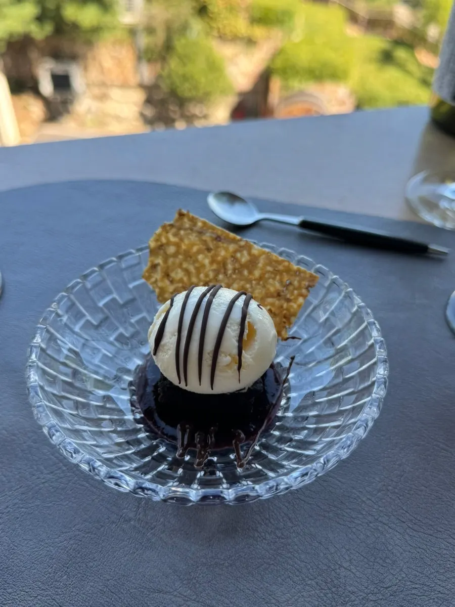 Two glasses of iced coffee served with dessert