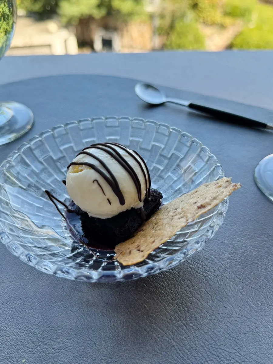 Brownie topped with crepe chips and ice cream