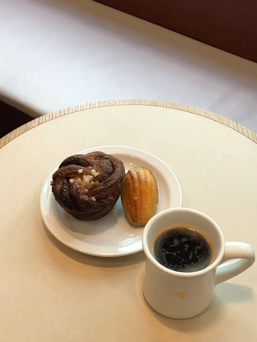 Order of Americano Blanc, cardamom bun, and yuzu lemon madeleine