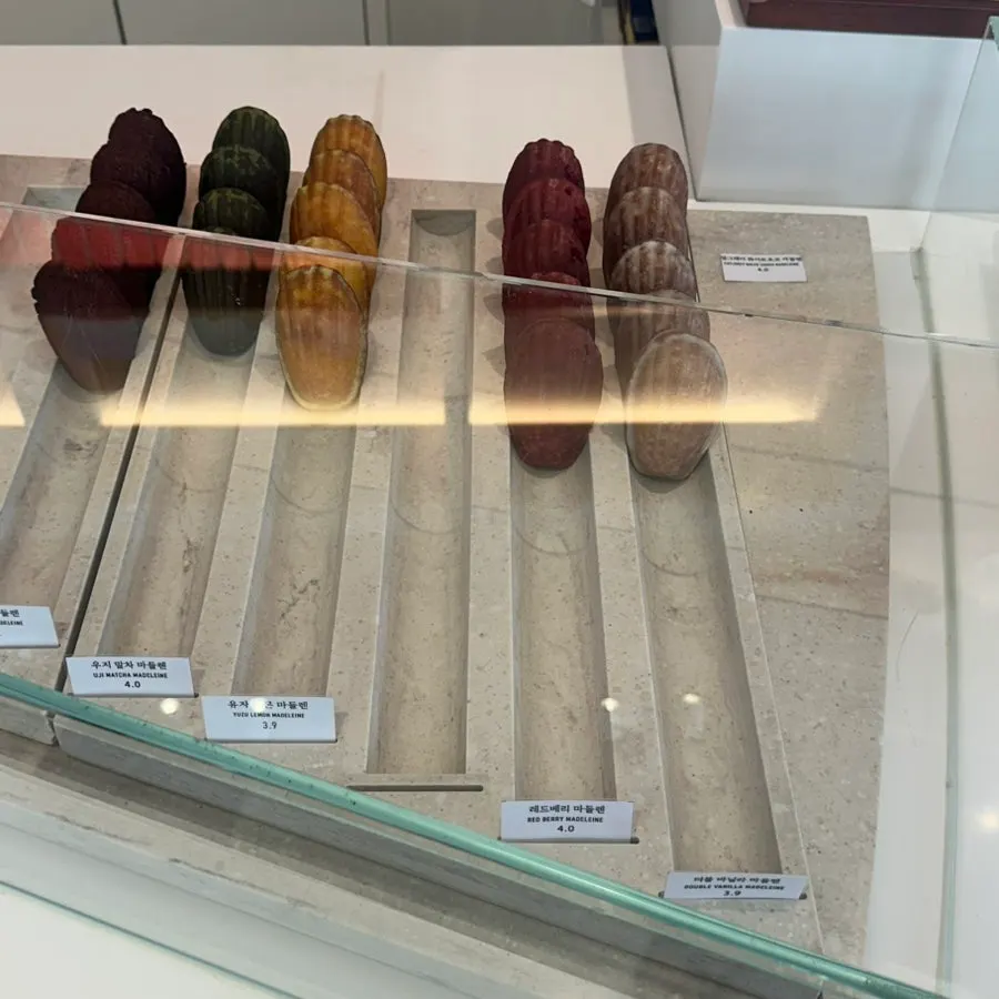 Showcase with financiers and madeleines