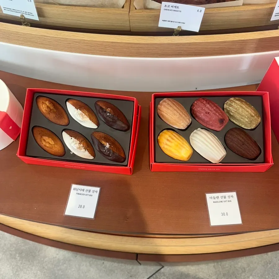 Financier and madeleine gift sets on display
