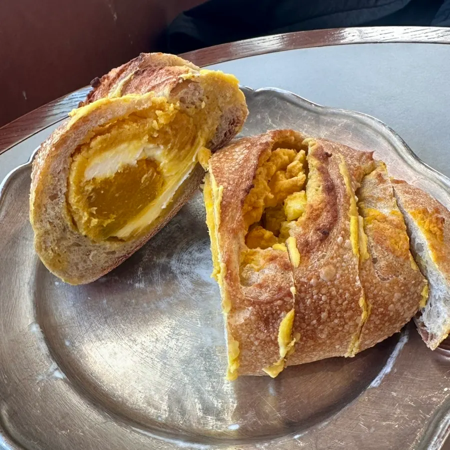 Cross-section of sourdough packed with pumpkin and cream cheese