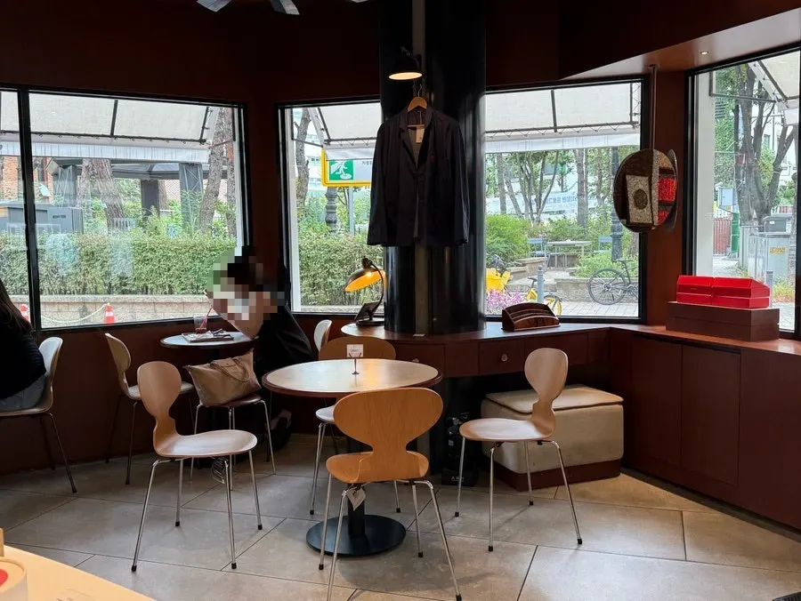 Store interior with wood-tone decor and large windows