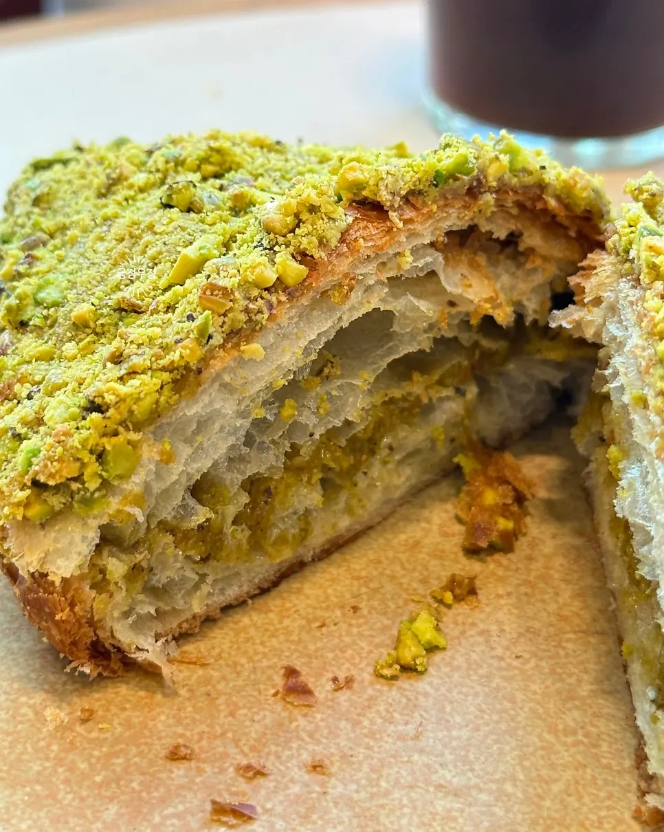 Pistachio croissant with coffee