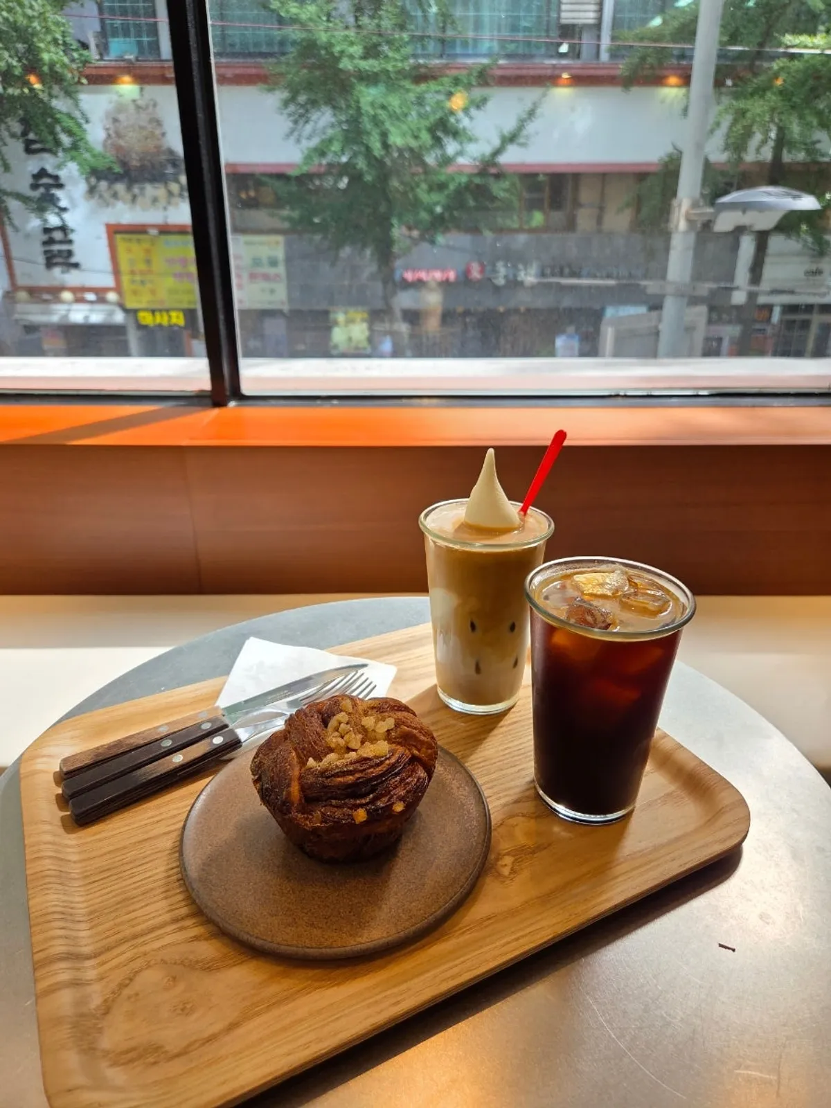 Ice cream float, iced Americano, and cardamom bun by the window