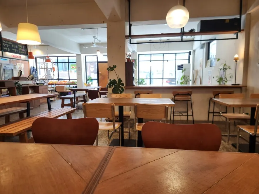 A corner of the restaurant with lighting and posters
