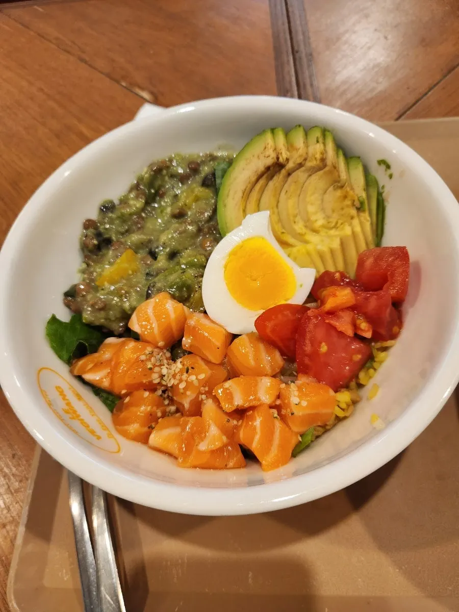 Salmon Bowl topped with raw salmon and avocado