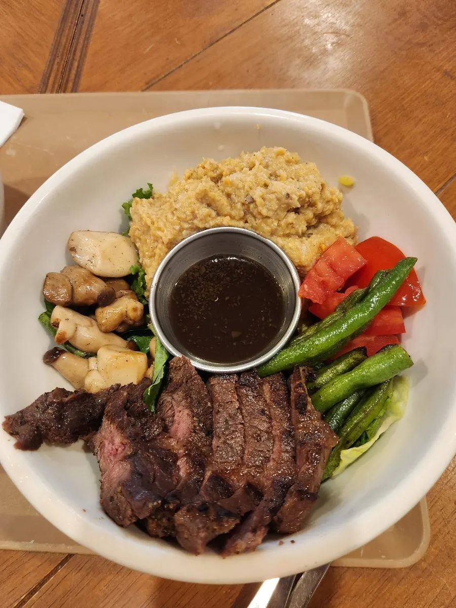 Steak Bowl topped with hanger steak