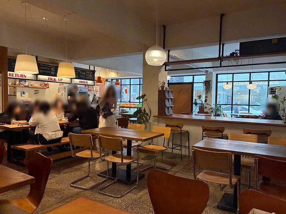 Interior lit by floor-to-ceiling windows