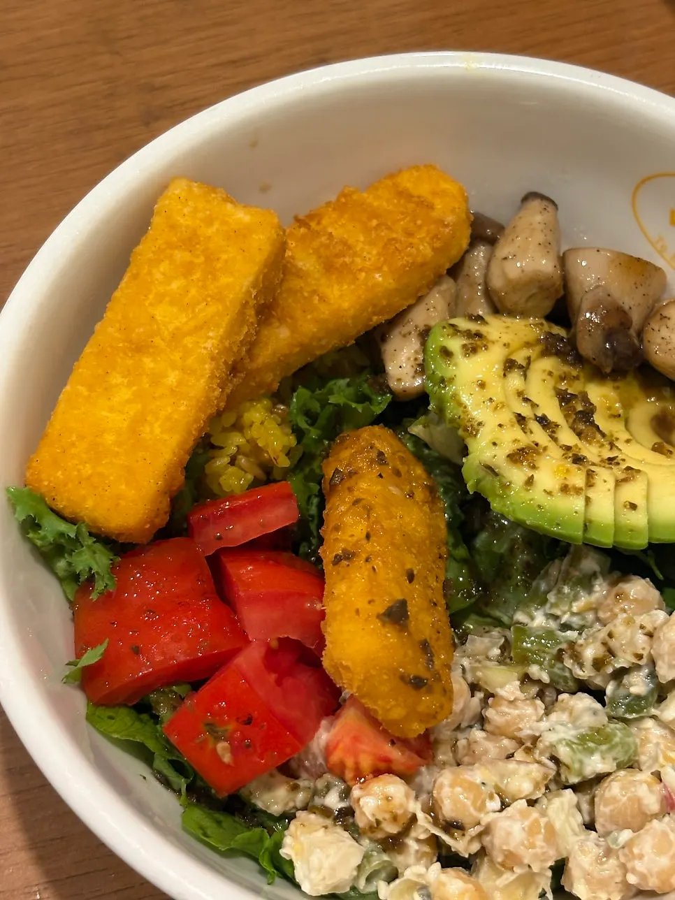 Dua Bowl topped with tofu nuggets, mushrooms and avocado