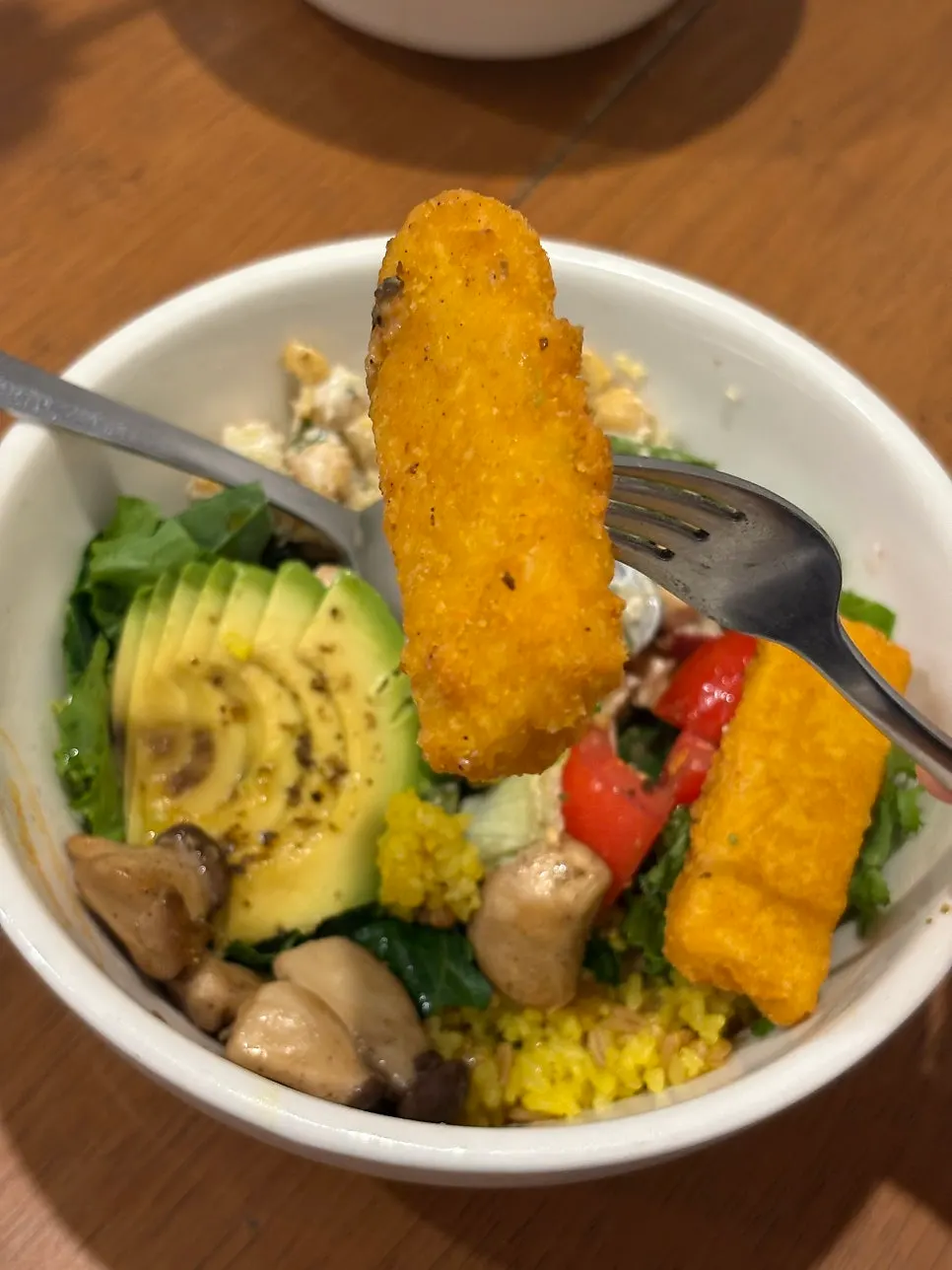 A spoonful of oat rice and avocado together