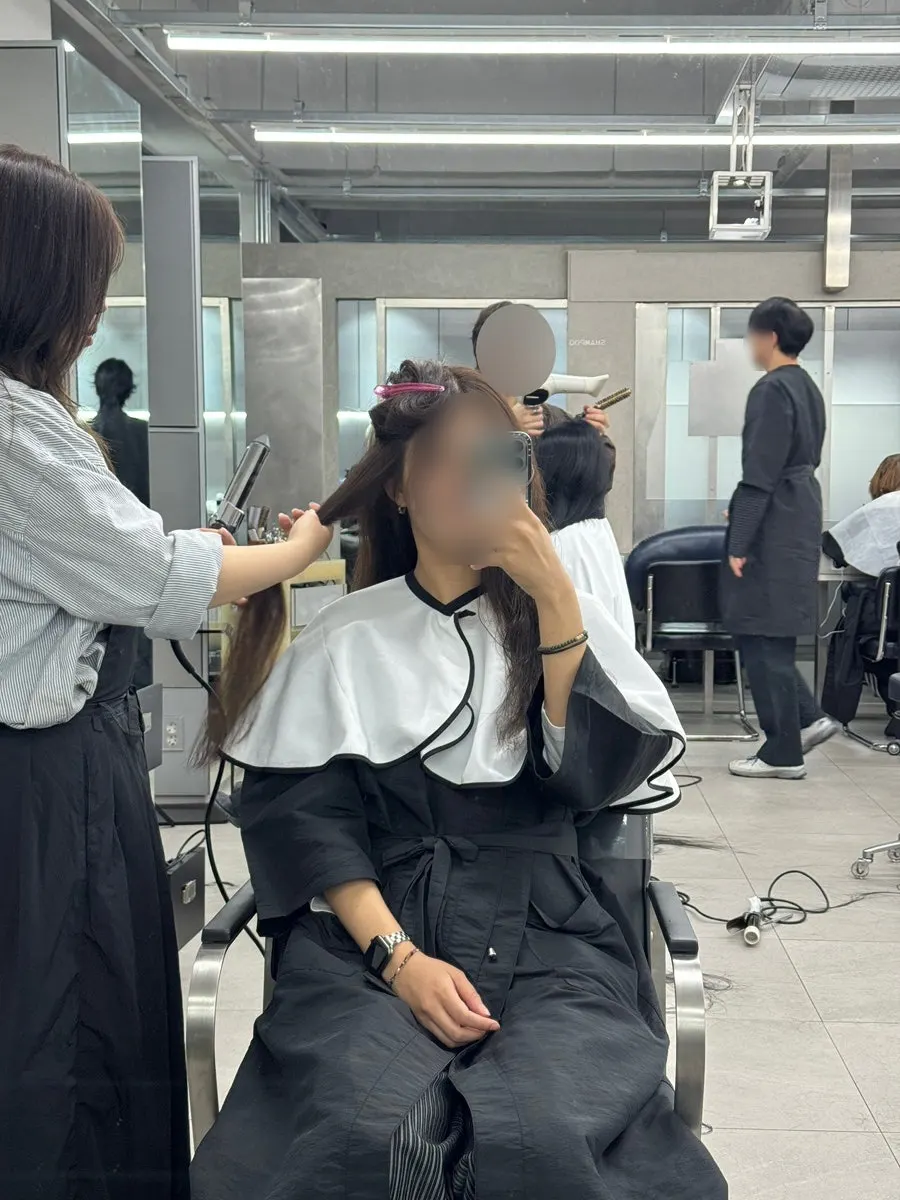 Matte brown hair finished with blow-dry styling