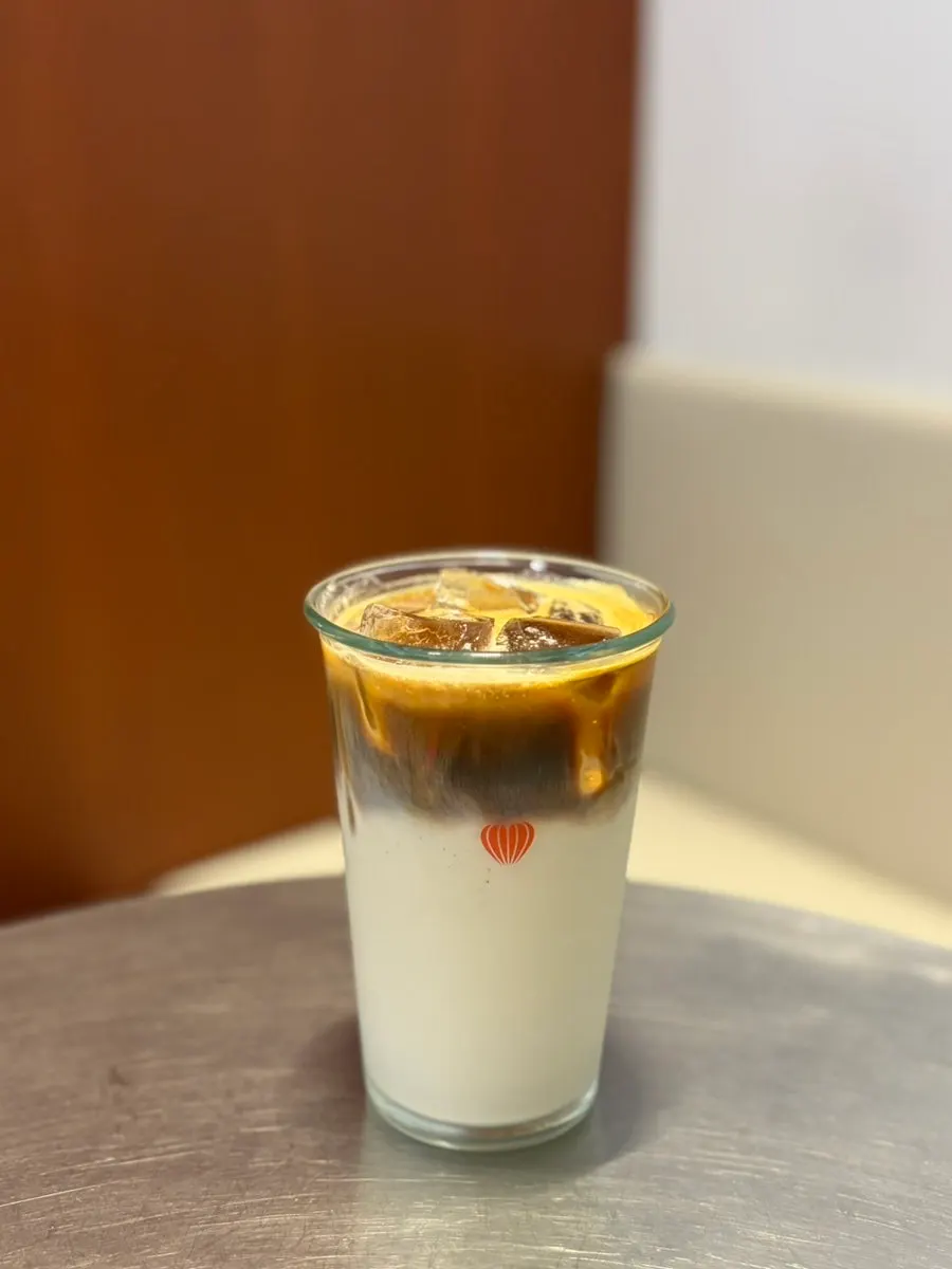 Vanilla latte with distinct milk and coffee layers
